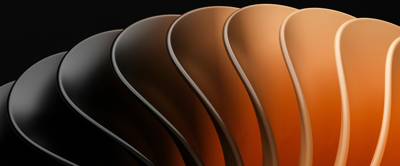 Abstract 3D render of curved layers shading from black to orange, like steps along a path